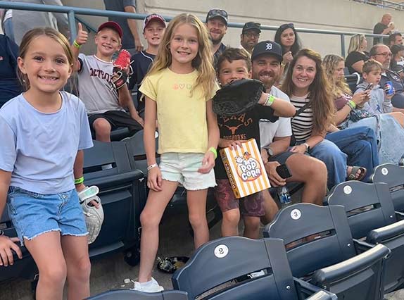 Monroe Environmental employees and families at a Mud Hens game