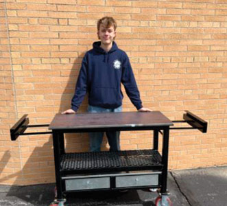 student in Ida HS welding program and his project