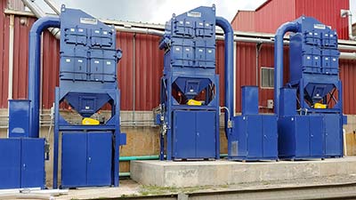 Monroe Cartridge Dust Collectors, rated for 4,000 CFM each to exhaust and capture crystalline silica particulate for a brick manufacturer. Interconnecting ductwork and the batching damper system with associated controls was also included.