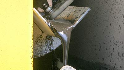 Monroe Belt-Type Oil Skimmer reclaiming condensed grease from venturi scrubber tank