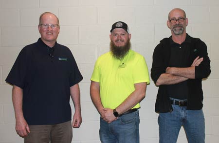 Mike Knabusch, Monroe Environmental HR Manager, Stephen Hasselbach, Monroe County Community College Welding Instructor, and Gene Paul, Monroe Environmental Shop Manager at high school welding competition