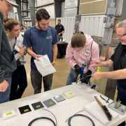 Students try their hand at plastics welding at Monroe Environmental's plastics welding station at a recent career fair