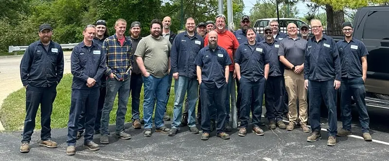 group shot of the Monroe Environmental shop team