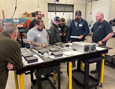 Judges evaluate the entries for the MCCC Annual High School Welding Competition