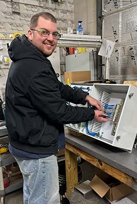 tech wiring an electrical panel
