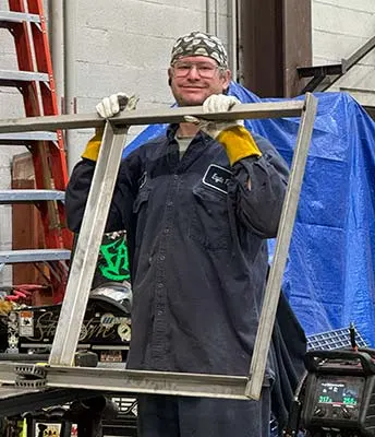a fabricator working in Monroe's shop