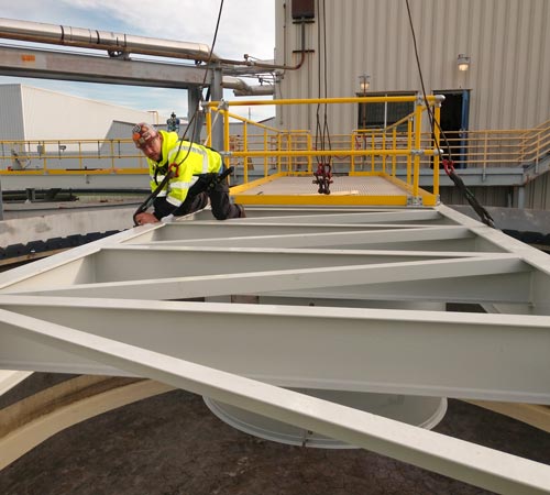 Field service specialist working on Clarifier bridge