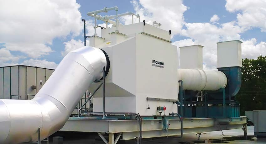 30,000 CFM horizontal packed bed chemical fume scrubber with polypropylene construction to remove chemical fumes emitted from acid-dip tanks at a semiconductor manufacturing facility.