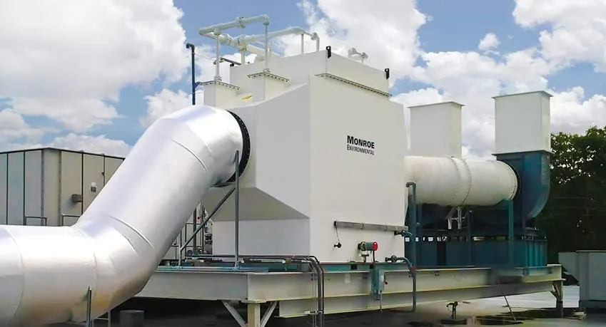 30,000 CFM horizontal packed bed chemical fume scrubber with polypropylene construction to remove chemical fumes emitted from acid-dip tanks at a semiconductor manufacturing facility.