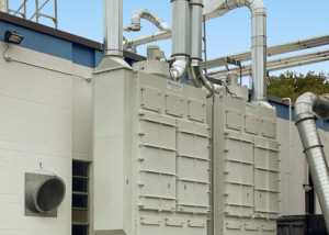 (2) Fiber Bed Mist Collection Systems rated up to 6,000 CFM each to exhaust Silicone Casting Ovens for a medical parts manufacturer. The units are installed outdoors.