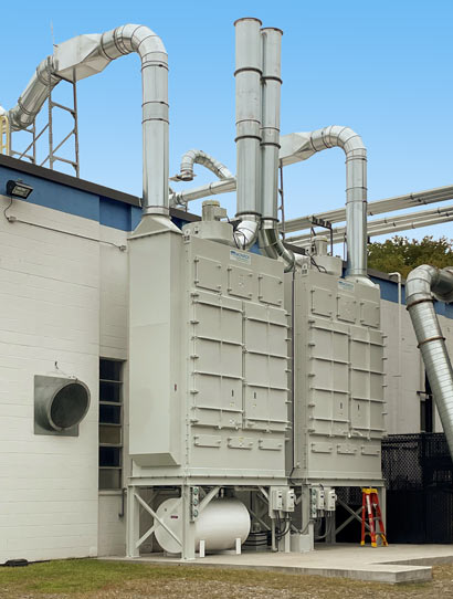 6,000 CFM Fiber Bed Mist Collector (2) Fiber Bed Mist Collection Systems rated up to 6,000 CFM each to exhaust Silicone Casting Ovens for a medical parts manufacturer. The units are installed outdoors.