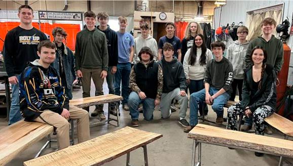 Ida students group shot with tables and benches