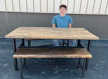 Ida student with table and benches