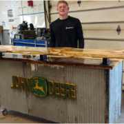 Welding student with his project
