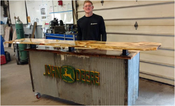 Welding student with his project Welding student with his project