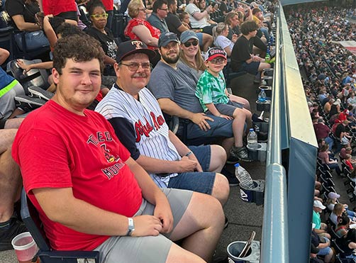 Monroe Environmental employees watching Toledo Mud Hens game