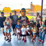 Monroe Environmental employees and their children at a Mud Hens game