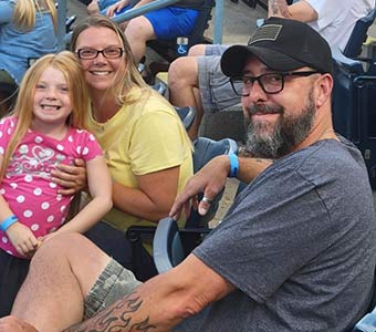 Monroe employees and their families watching the game