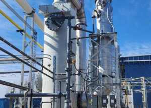 Multi-Stage Scrubbing System with Packed Tower Scrubber and Quench Tower