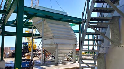 612 GPM Vertical Clarifier for fertilizer processing plant to aid in the removal of non-hindered concentrations of biological solids from a weak ammonia nitrate solution.