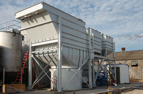 Vertical Plate Clarifier for an insulation manufacturer; with three pretreatment mixing tanks to clarify process water at specialty insulation manufacturing plant. The system included an integral sludge thickener and was rated for 750 GPM.