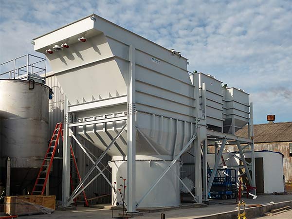 750 GPM Vertical Plate Clarifier with Thickener Vertical Plate Clarifier for an insulation manufacturer; with three pretreatment mixing tanks to clarify process water at specialty insulation manufacturing plant. The system included an integral sludge thickener and was rated for 750 GPM.