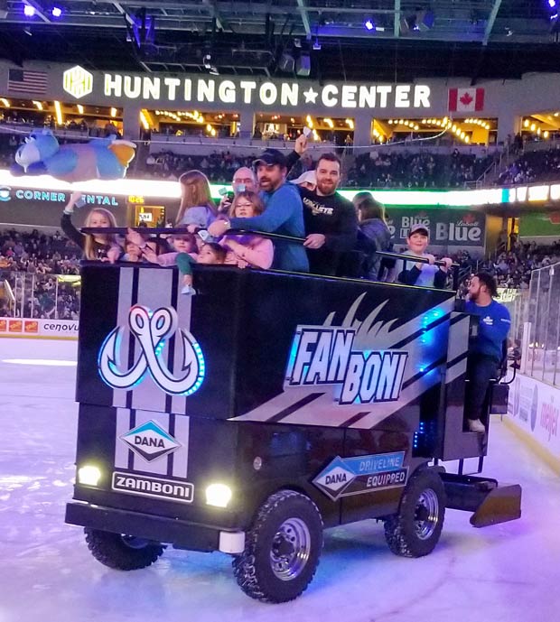 MEC employees and their families riding the Fanboni at a Toledo Walleye hockey game.