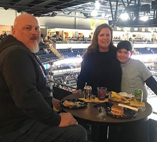 Monroe Environmental employees enjoy a Walleye game