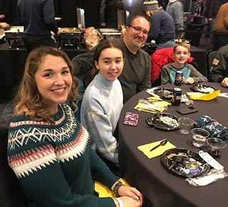 Monroe Environmental employees enjoy a Walleye game